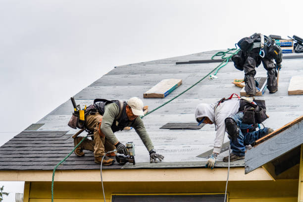 Professional Roofing technician working in Rockwell, IA